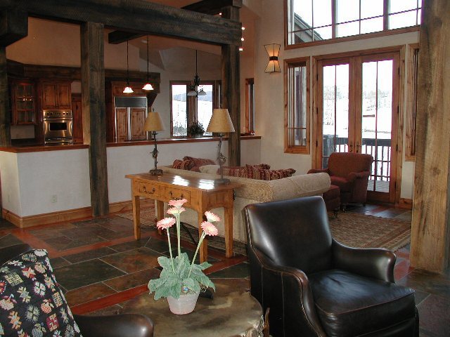 147 Adams Ranch Road Mountain Village, CO 81435 - Photo 4 of 9 a dining room with furniture a chandelier and wooden floor