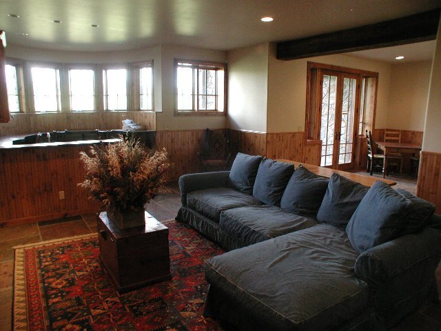 147 Adams Ranch Road Mountain Village, CO 81435 - Photo 7 of 9 a living room with furniture and a large window