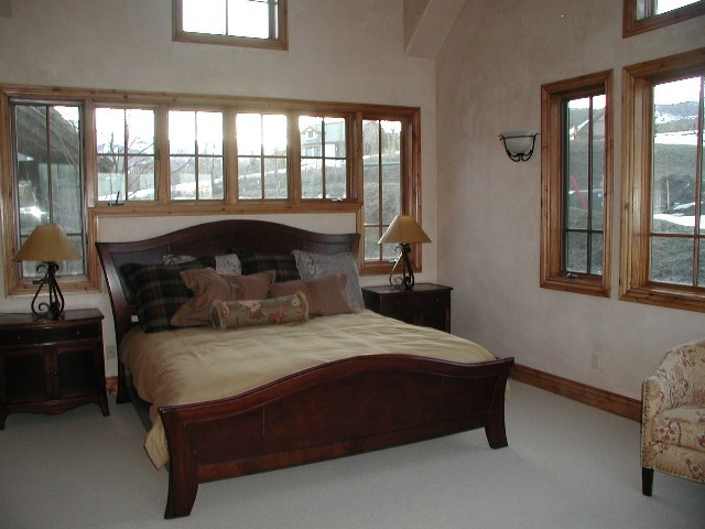 147 Adams Ranch Road Mountain Village, CO 81435 - Photo 9 of 9 a bedroom with a bed and window