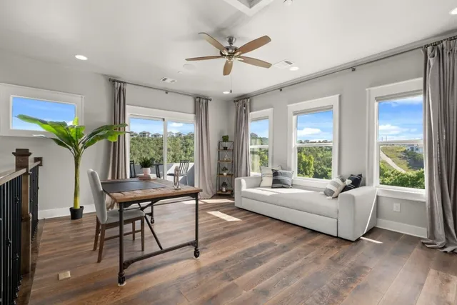 a living room with furniture fireplace and a flat screen tv