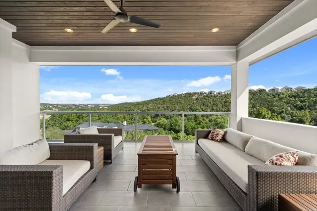 a view of a patio with swimming pool table and chairs