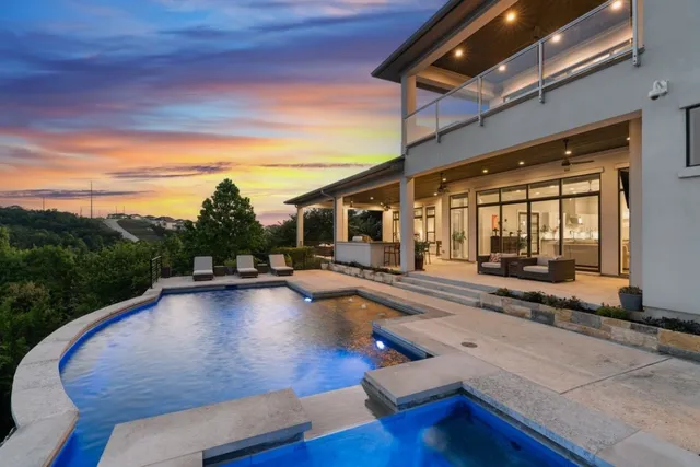 swimming pool view with a garden