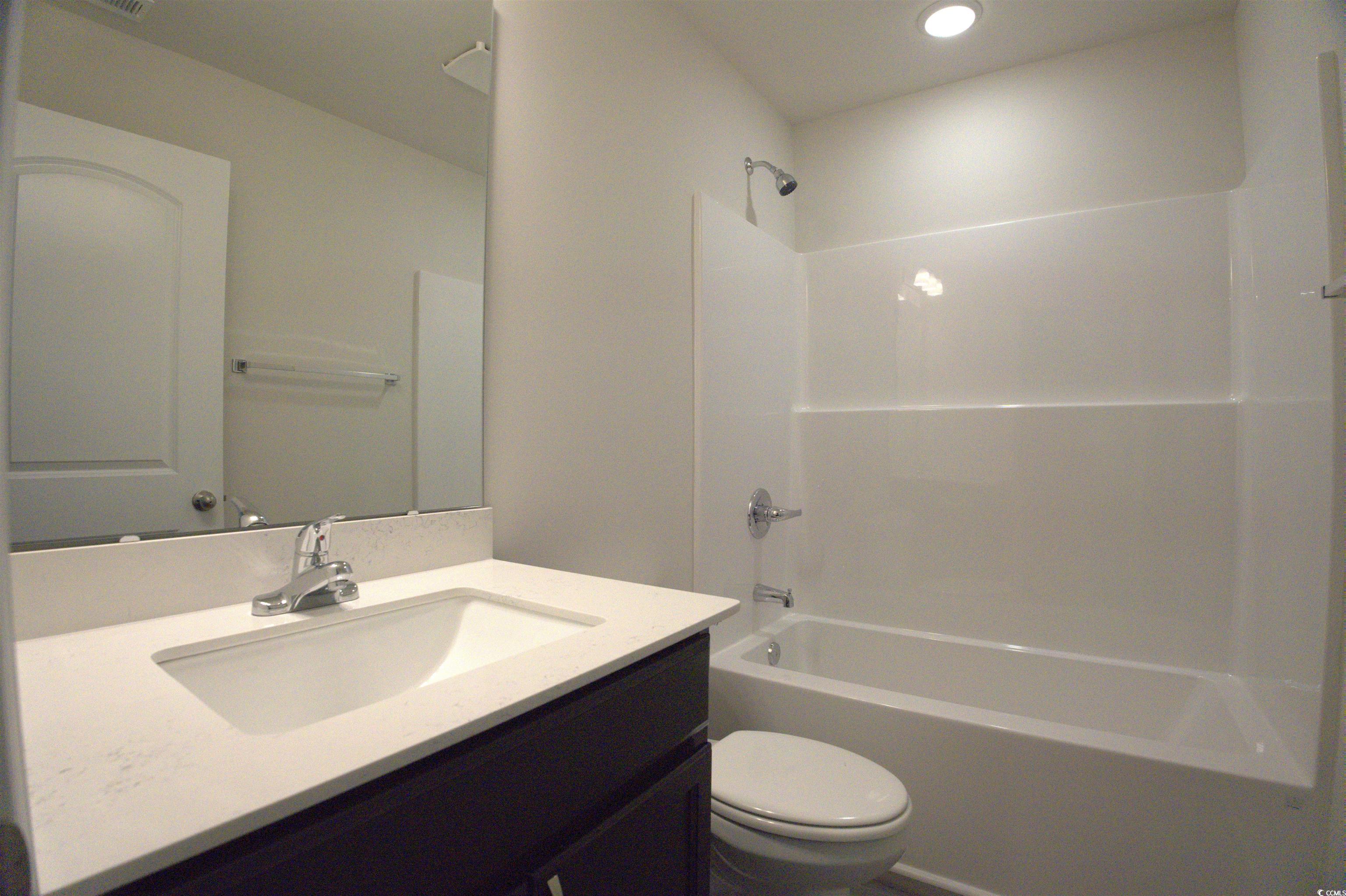 209 Kc Lane Aynor, SC 29511 - Photo 8 of 13 Bathroom featuring shower / tub combination, vanity, and recessed lighting