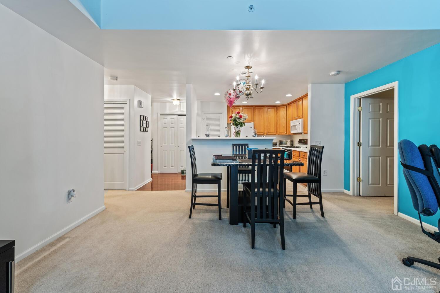 358 Rector Street, Unit 407 Perth Amboy, NJ 08861 - Photo 16 of 28 a view of a dining room with furniture