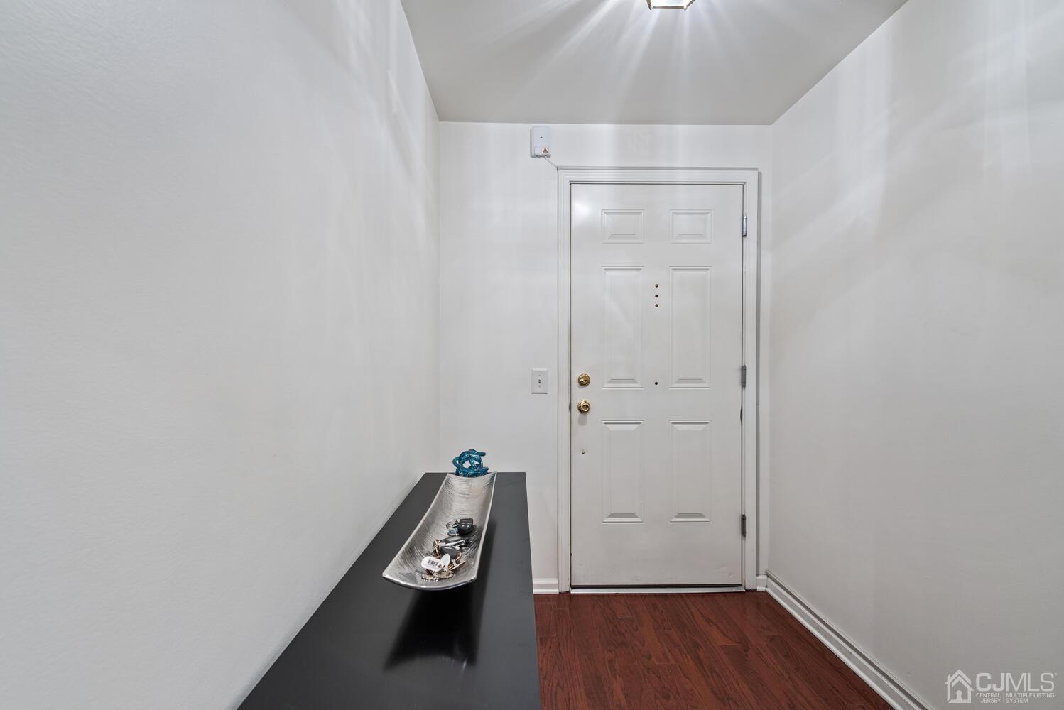 358 Rector Street, Unit 407 Perth Amboy, NJ 08861 - Photo 23 of 28 a view of a hallway with wooden floor