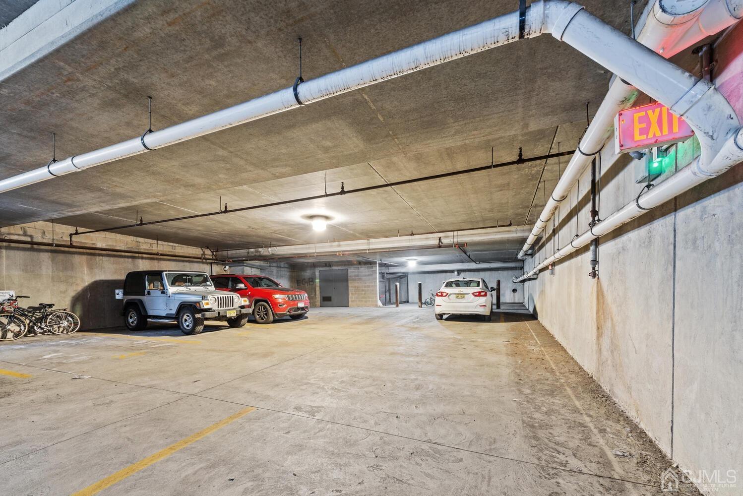 358 Rector Street, Unit 407 Perth Amboy, NJ 08861 - Photo 25 of 28 a view of a garage with cars