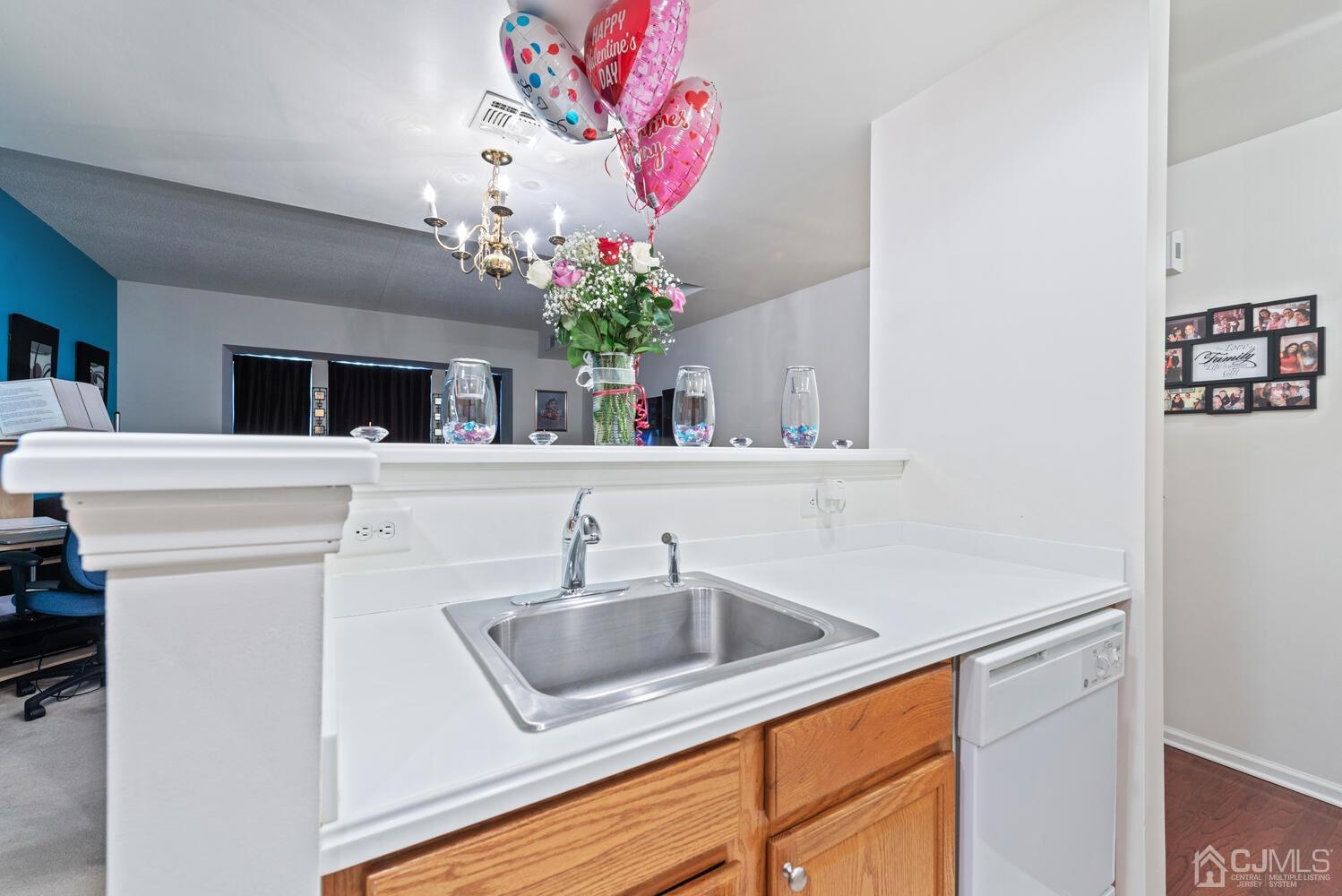 358 Rector Street, Unit 407 Perth Amboy, NJ 08861 - Photo 10 of 28 a bathroom with a sink a vanity and a mirror