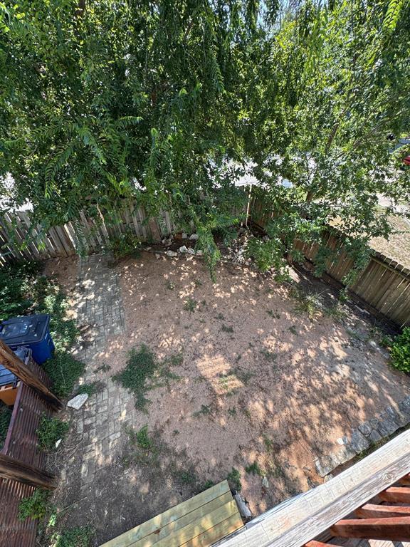 201 West 33rd Street, Unit B Austin, TX 78705 - Photo 26 of 27 a view of a yard with plants and trees