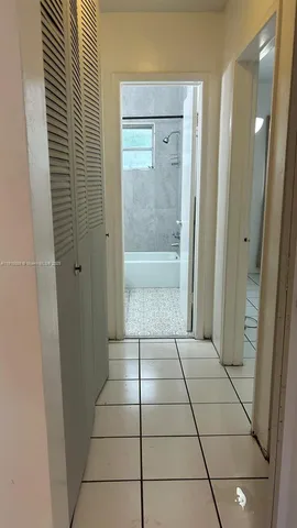 a bathroom with a glass door shower