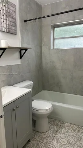 a bathroom with a sink a toilet and a bathtub