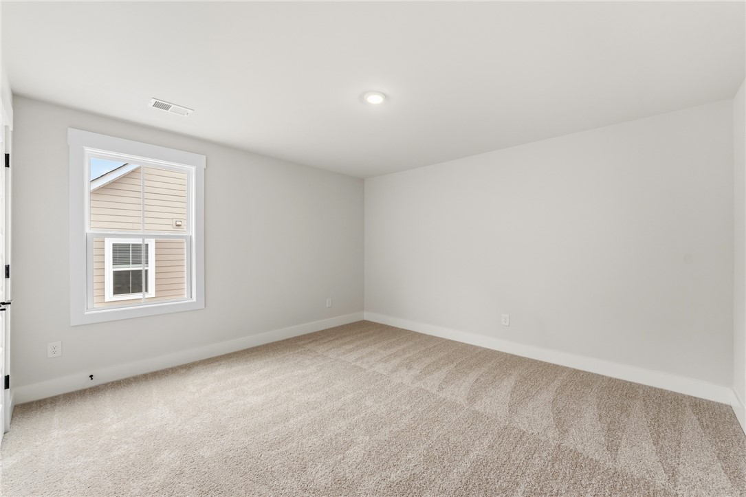 319 Summerall Drive Anderson, SC 29621 - Photo 30 of 37 This light-filled room features plush carpeting and a clean, neutral palette.