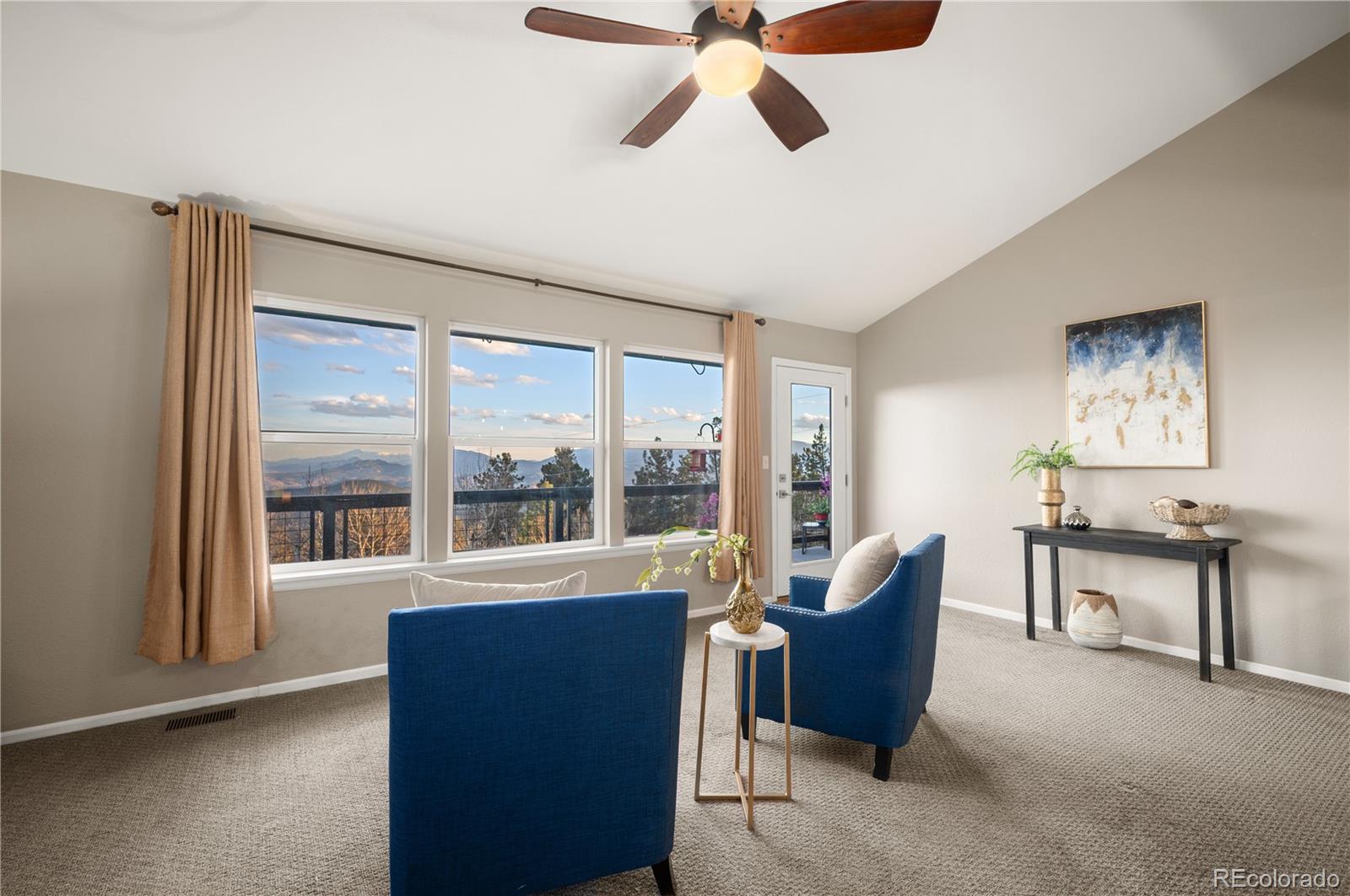 11740 Baca Road Conifer, CO 80433 - Photo 21 of 49 a living room with furniture and a large window