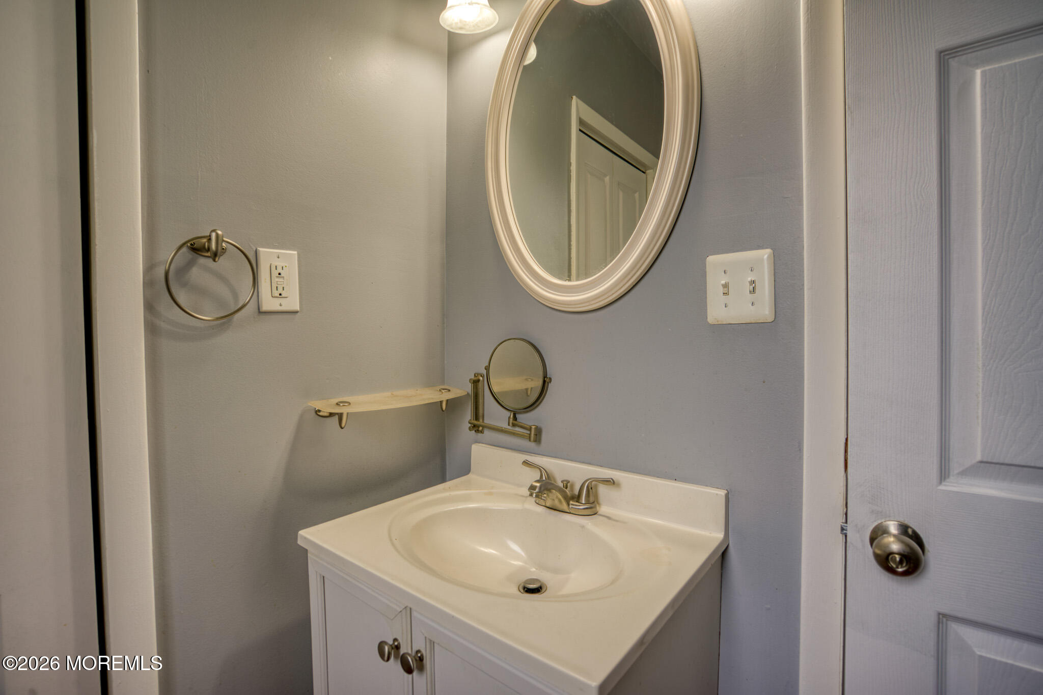 138 3rd Street Keyport, NJ 07735 - Photo 11 of 20 a bathroom with a sink and a mirror