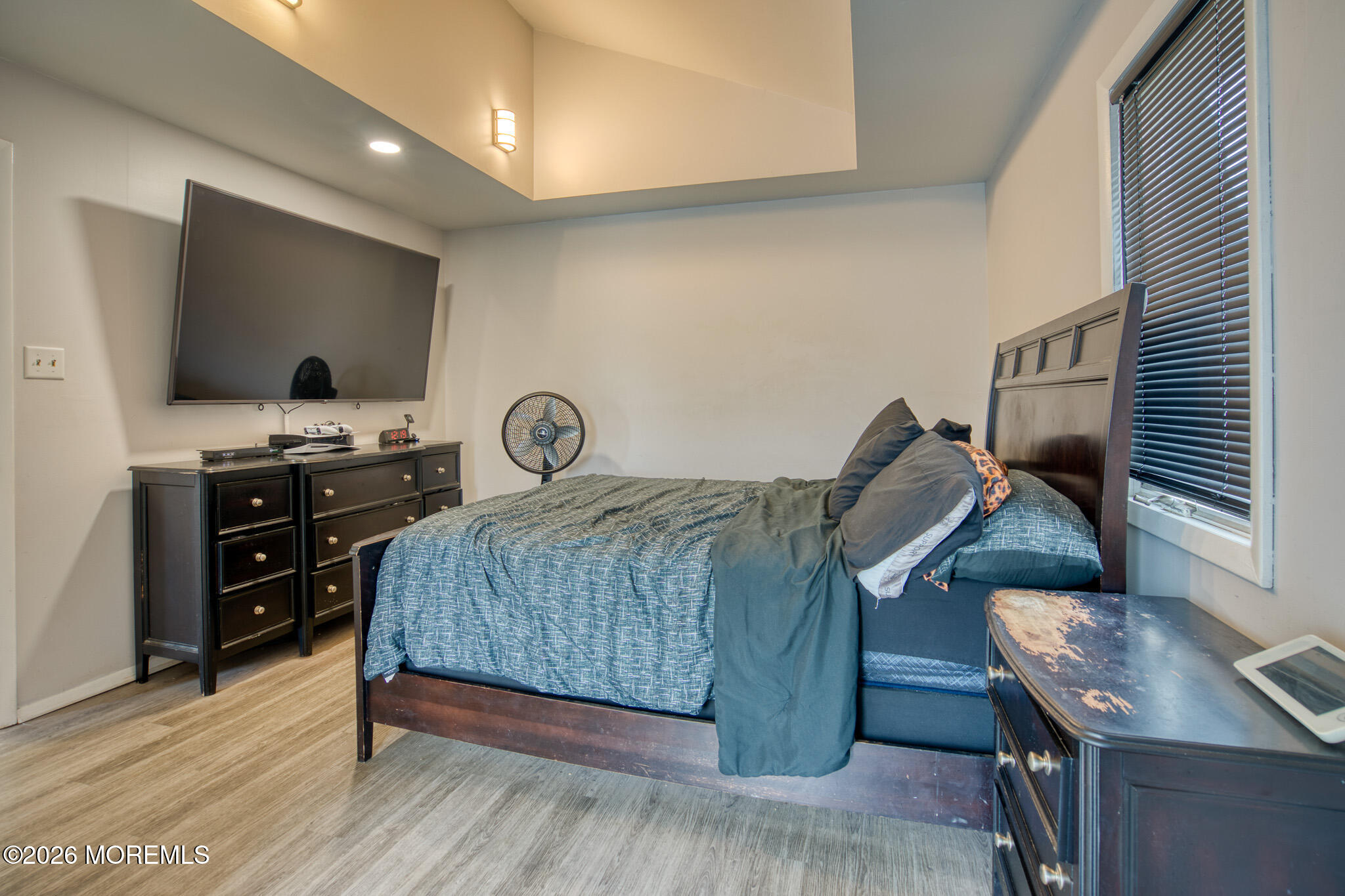 138 3rd Street Keyport, NJ 07735 - Photo 13 of 20 a bedroom with a bed and a flat screen tv