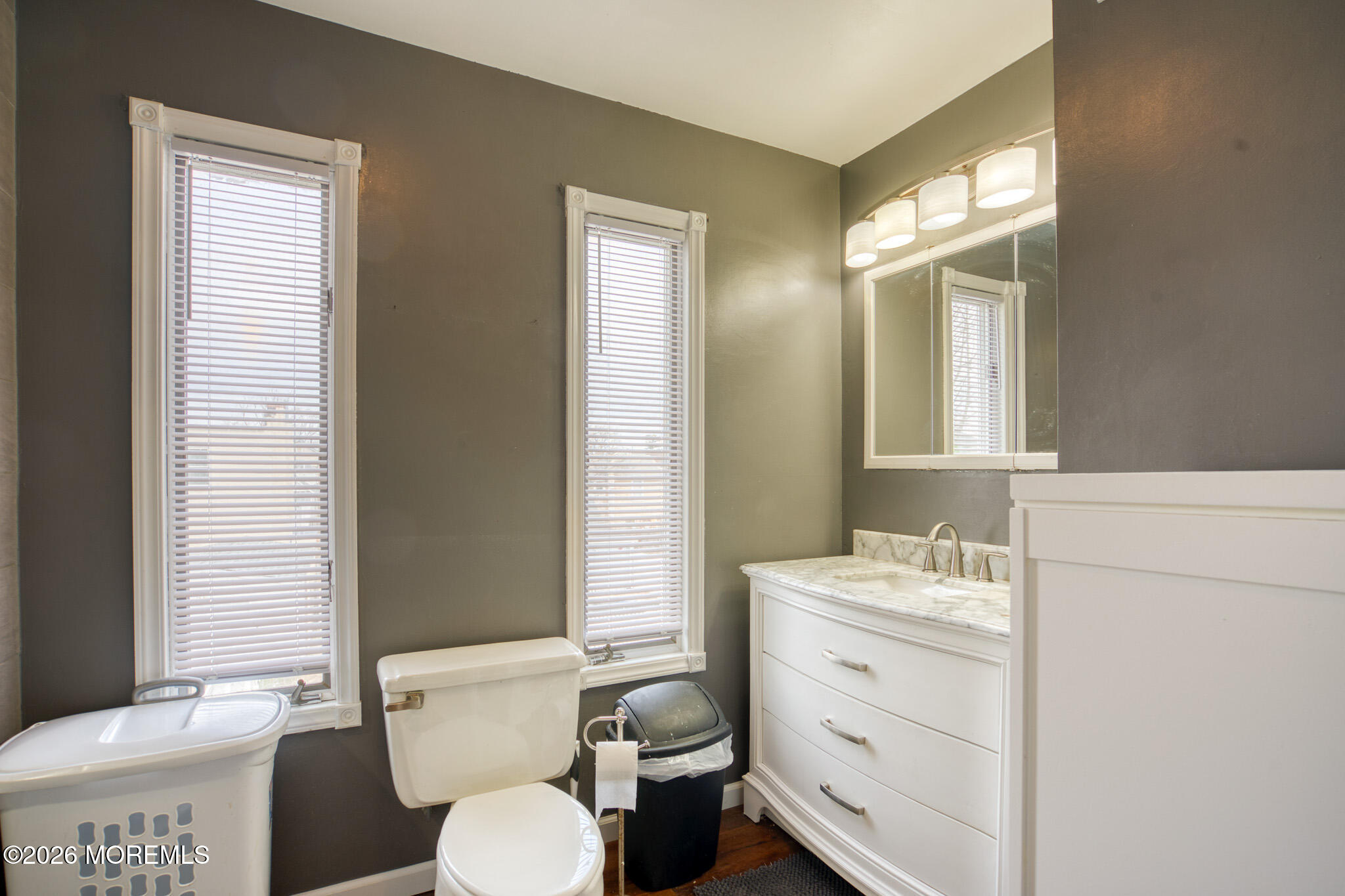 138 3rd Street Keyport, NJ 07735 - Photo 17 of 20 a bathroom with a toilet sink and mirror