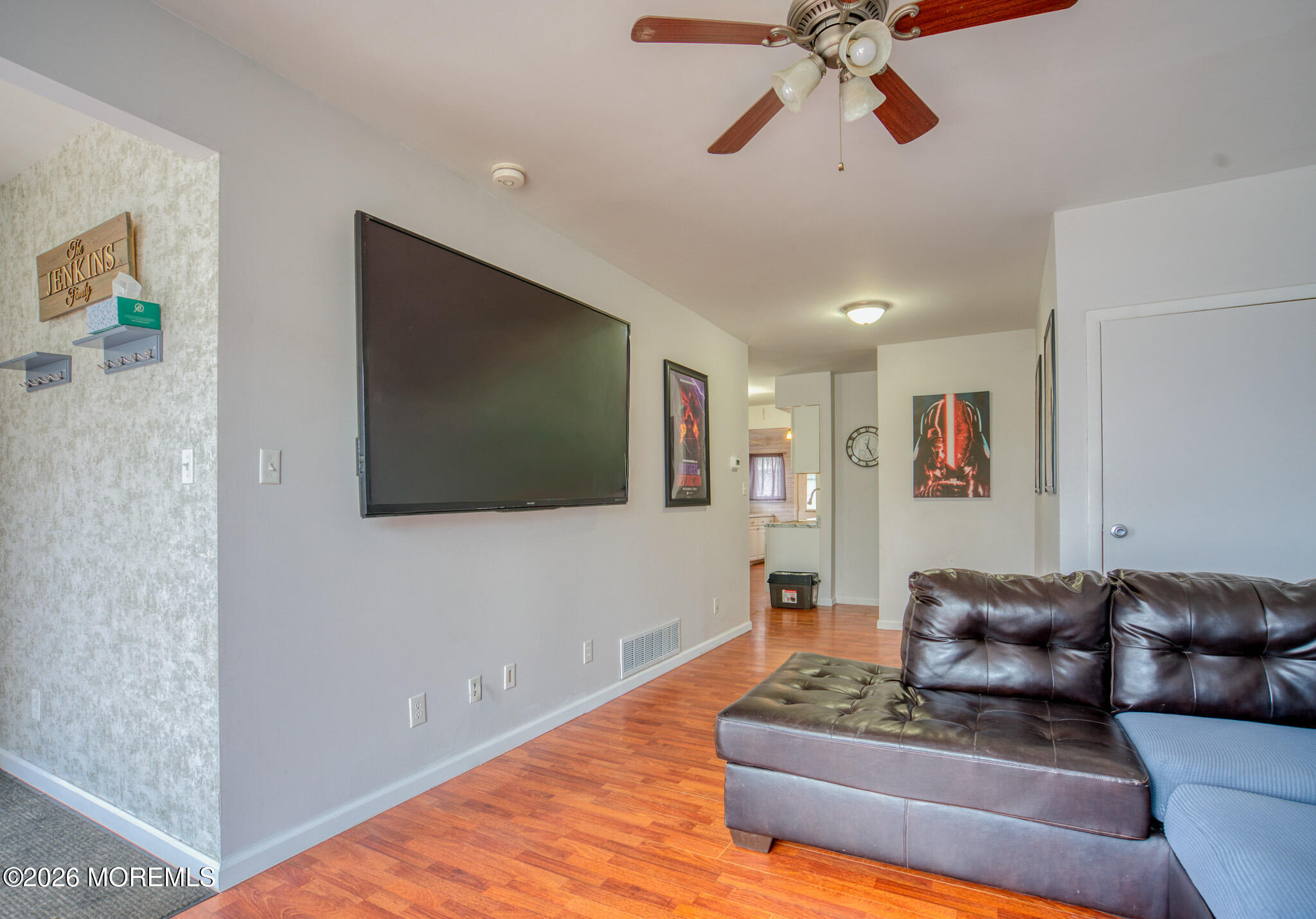 138 3rd Street Keyport, NJ 07735 - Photo 3 of 20 a living room with furniture and a flat screen tv
