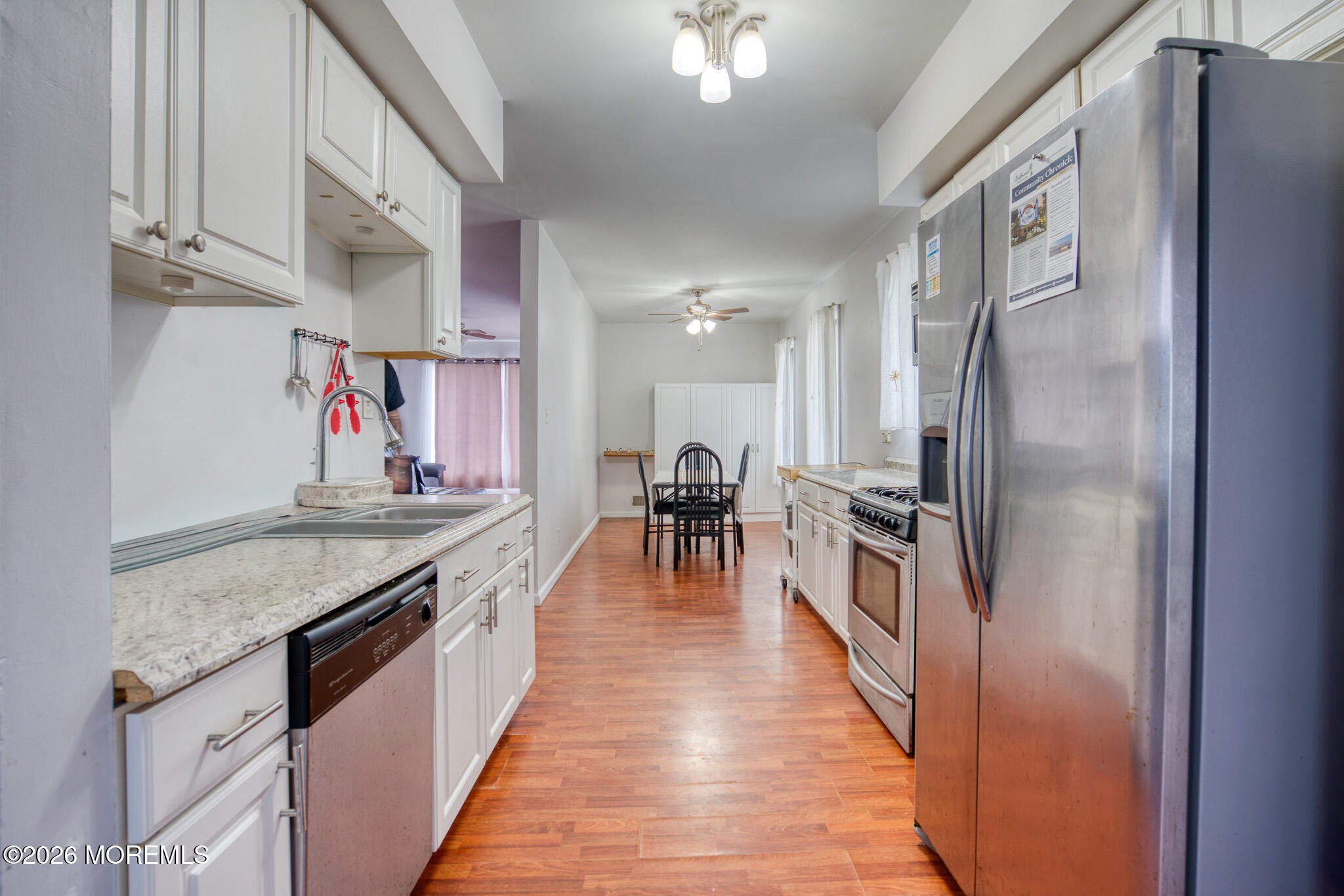 138 3rd Street Keyport, NJ 07735 - Photo 6 of 20 a kitchen with stainless steel appliances granite countertop lots of counter top space and wooden floor