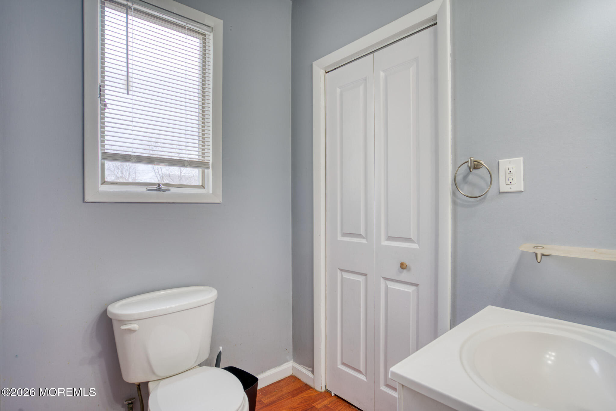 138 3rd Street Keyport, NJ 07735 - Photo 10 of 20 a white toilet sitting next to a bathroom sink