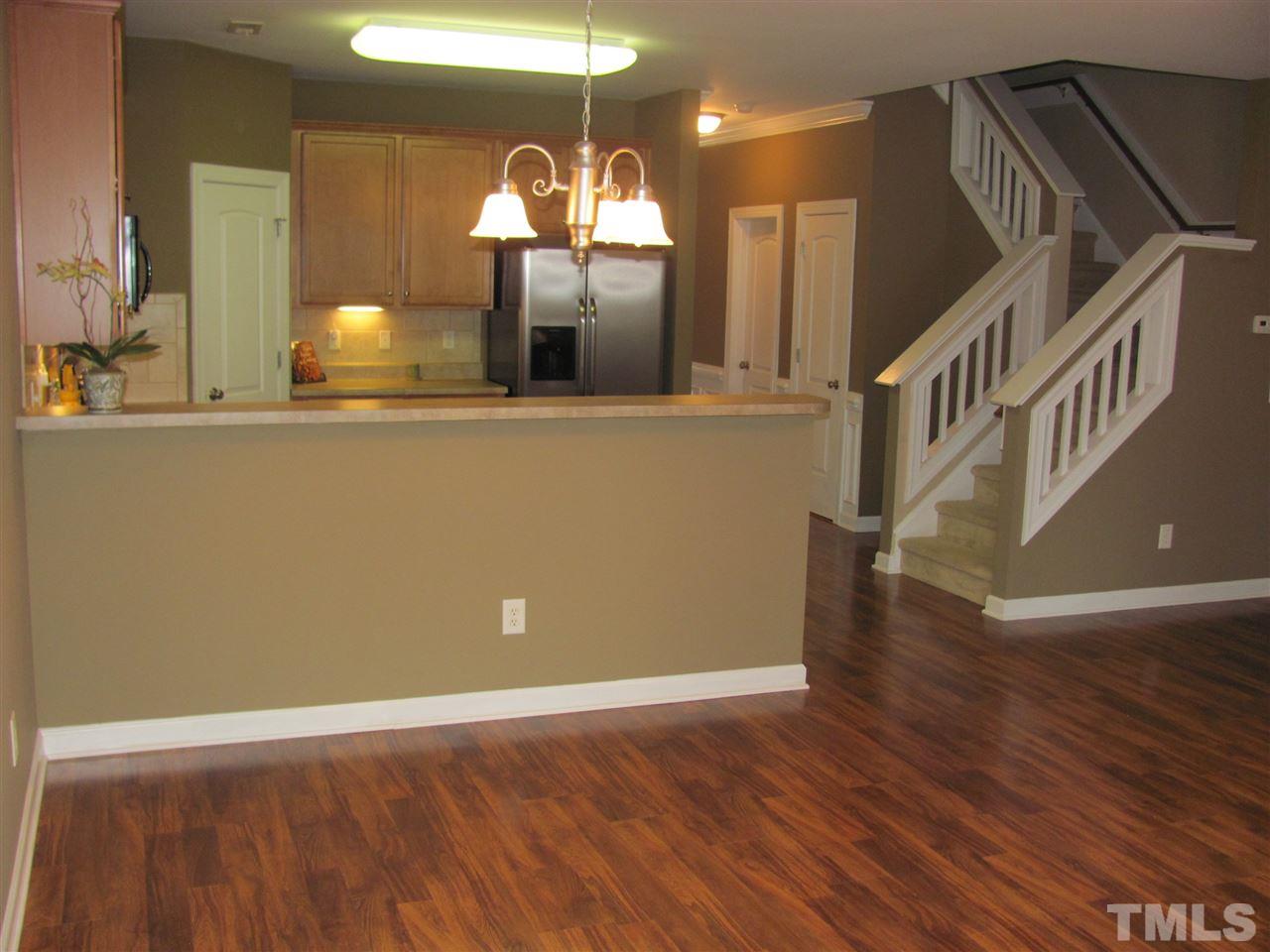 104 Leighann Ridge Lane Rolesville, NC 27571 - Photo 5 of 11 Adjacent to the kitchen is both a breakfast bar for those quick bites and just hanging out as well as a spacious formal dining table area for sharing a sit down meal with the family.