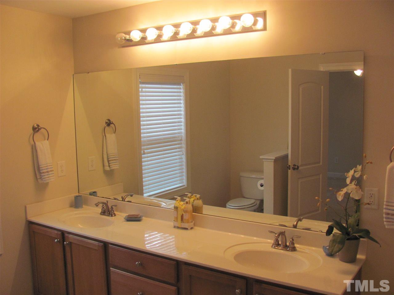 104 Leighann Ridge Lane Rolesville, NC 27571 - Photo 8 of 11 The master bath mirrors the master bedroom in both size and space! it features a long double sink vanity with plenty of cabinet space, a large garden tub and a separate walk in shower.