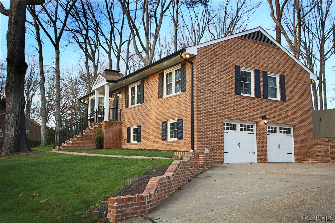 8414 Rubimont Road Richmond, VA 23235 - Photo 33 of 43 Concrete aggregate driveway. Insulated garage door