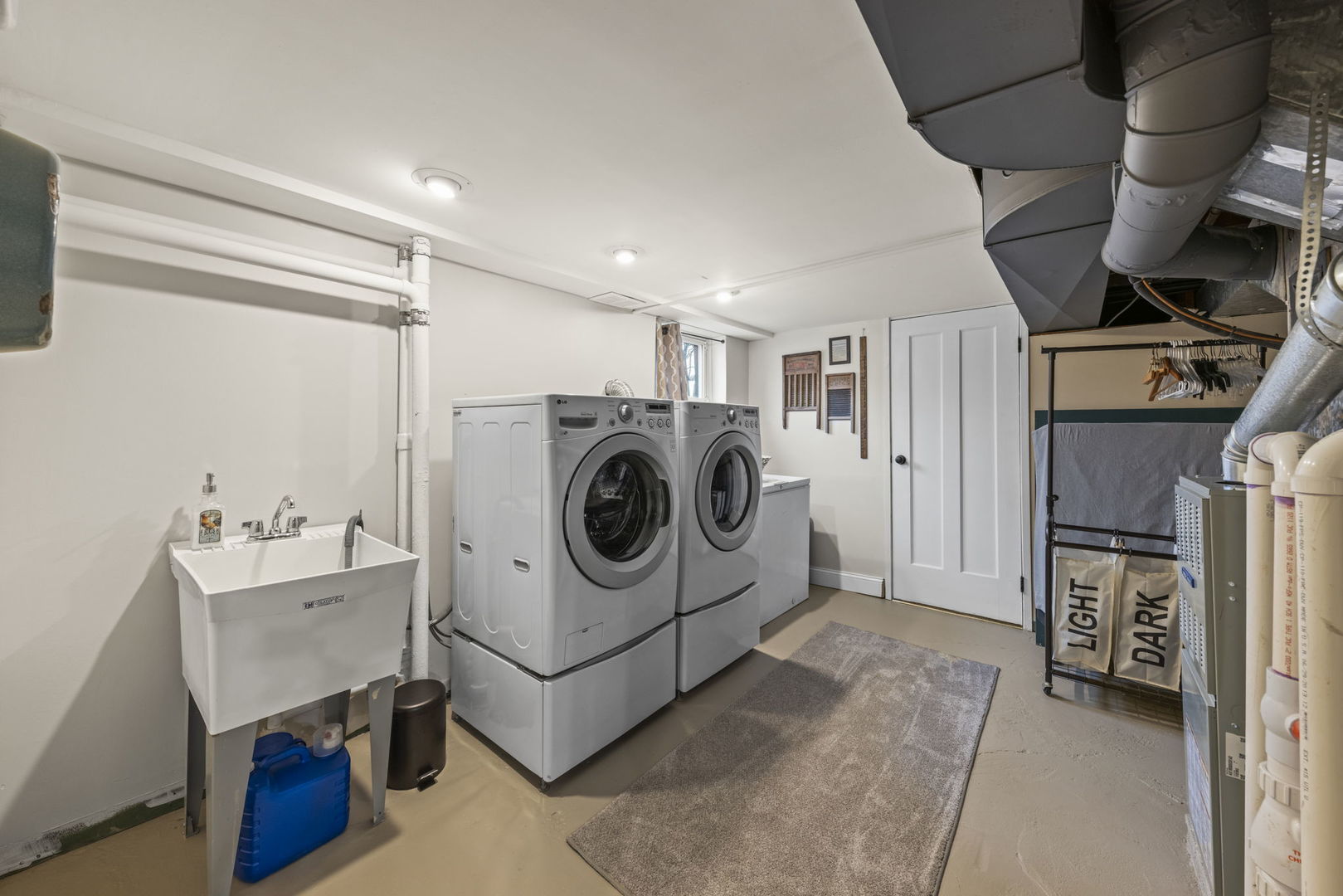 909 Webster Avenue Wheaton, IL 60187 - Photo 15 of 27 a utility room with dryer washer and a view of living room
