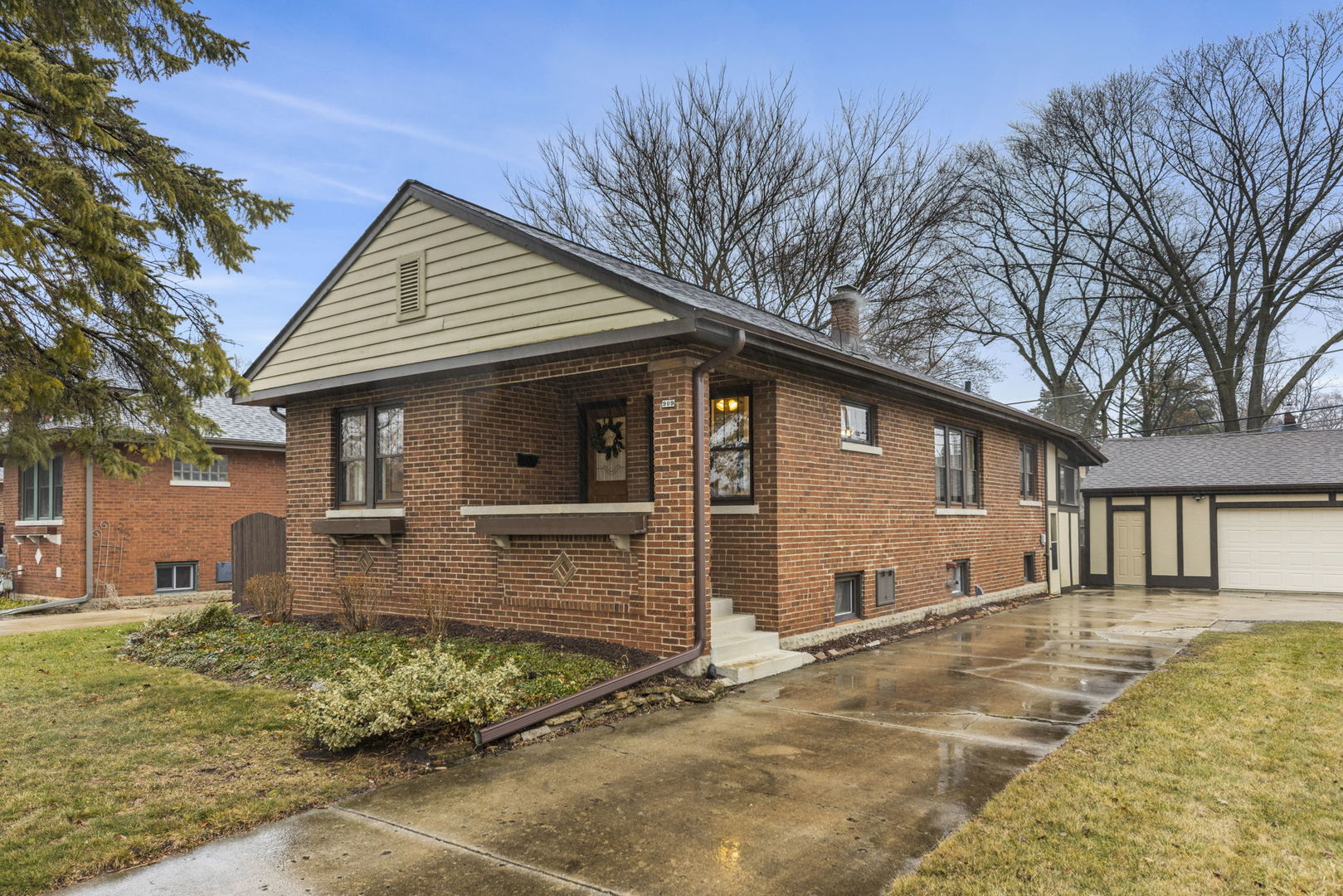909 Webster Avenue Wheaton, IL 60187 - Photo 22 of 27 a front view of a house with garden
