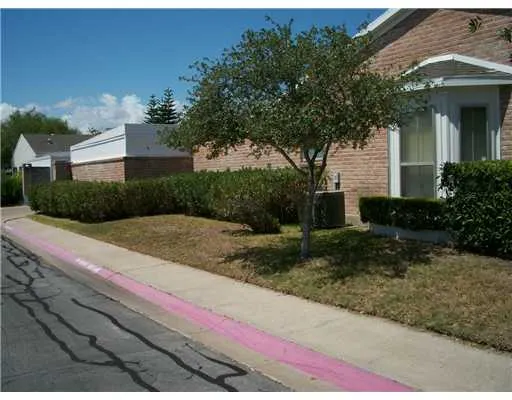 a view of a house with yard and tree s