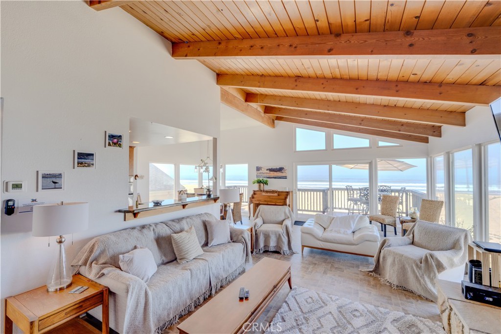 1612 Strand Way Oceano, CA 93445 - Photo 11 of 27 a living room with furniture and a large window
