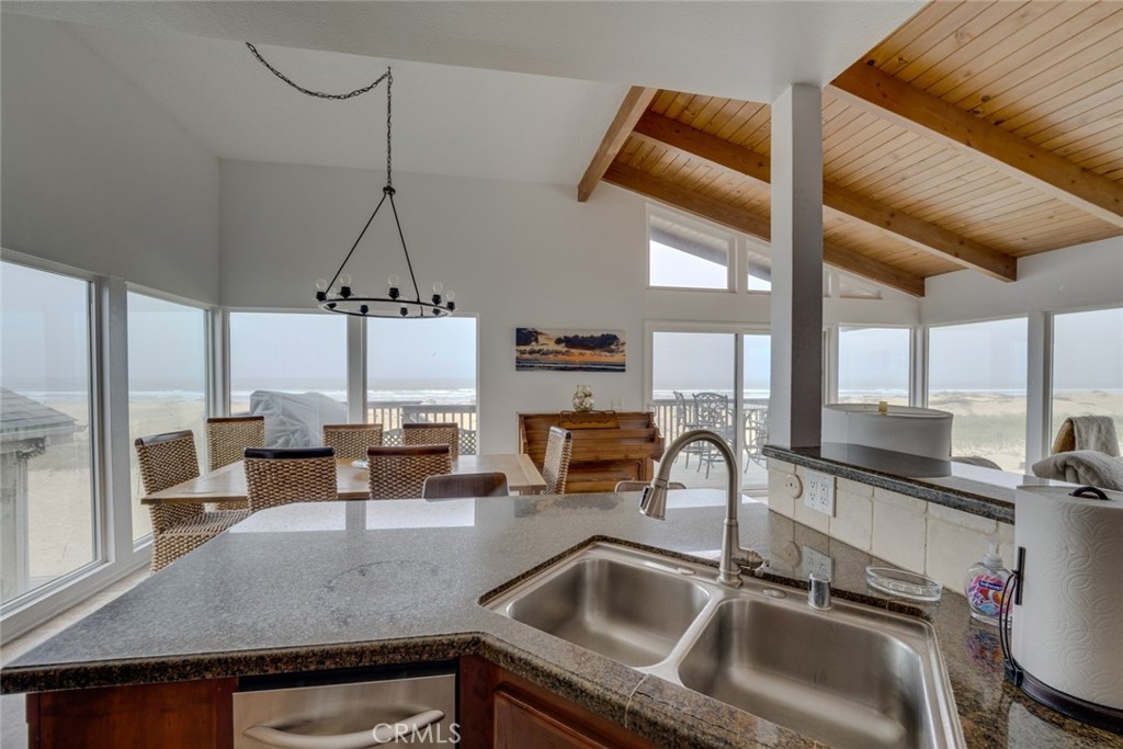 1612 Strand Way Oceano, CA 93445 - Photo 15 of 27 a kitchen with a sink a counter top space cabinets and a couch