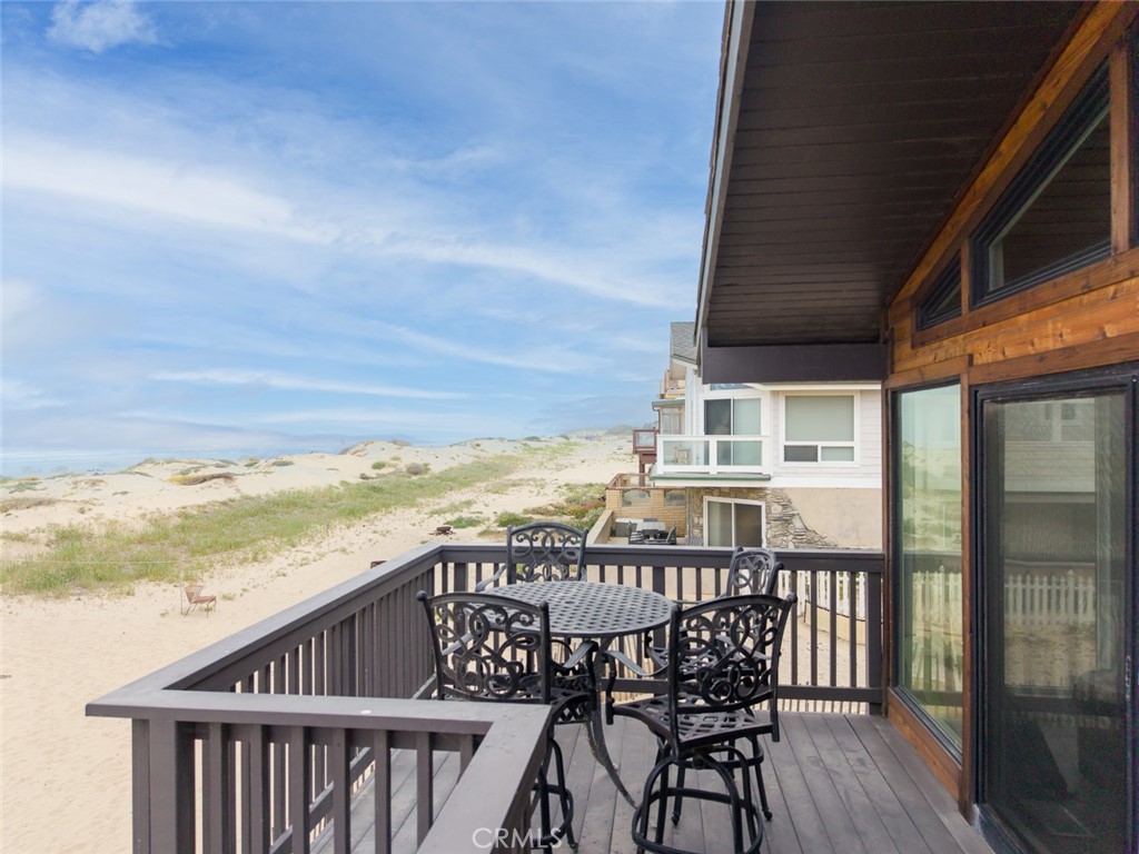 1612 Strand Way Oceano, CA 93445 - Photo 21 of 27 a view of a balcony with table and chairs