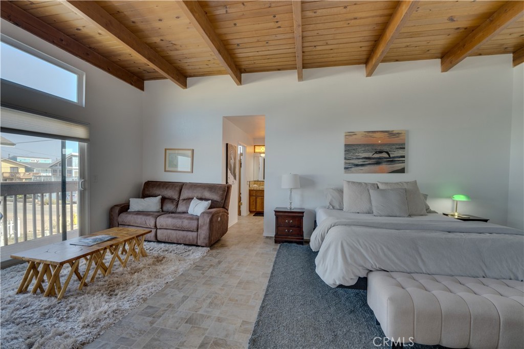 1612 Strand Way Oceano, CA 93445 - Photo 4 of 27 a bedroom with furniture and a couch