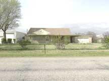 a view of a yard in front of a house