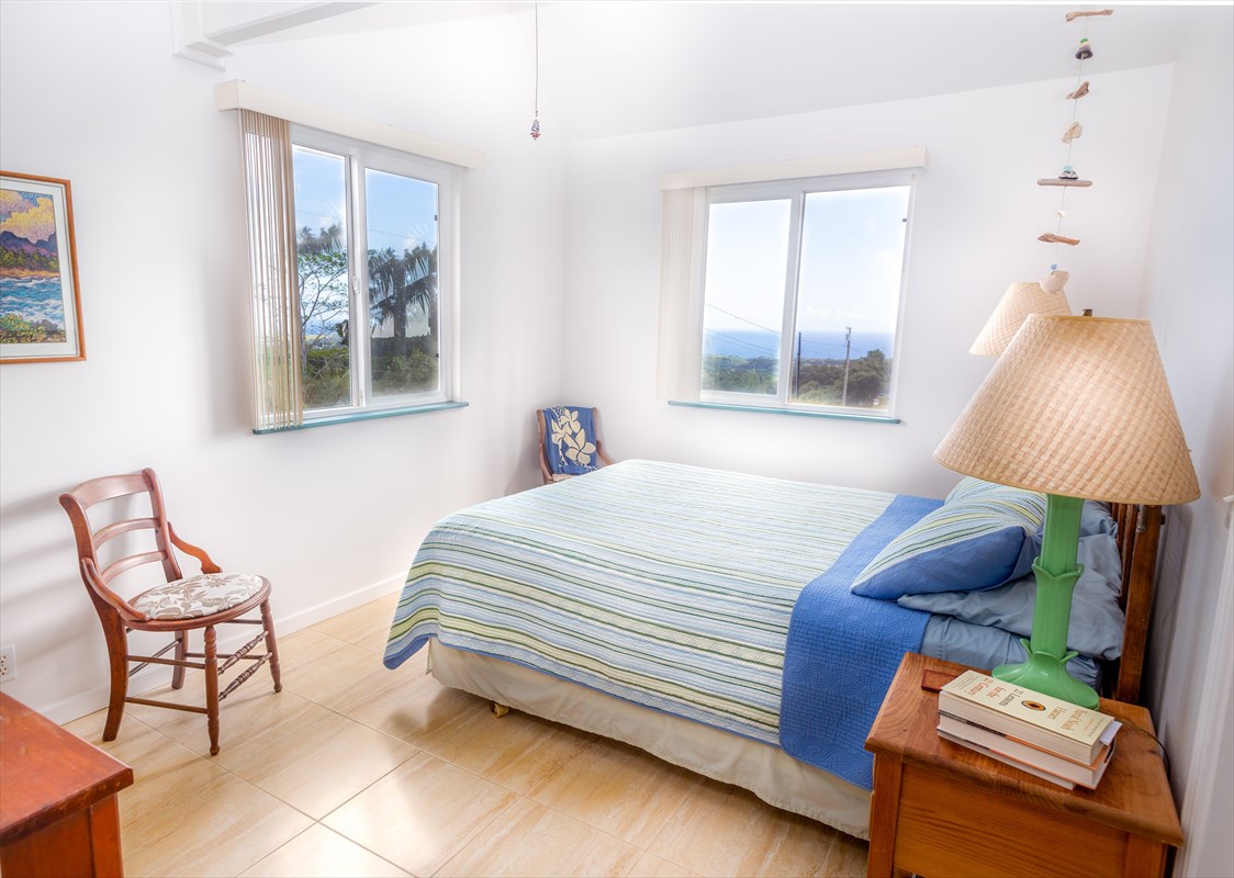 5001 Kikala Road, Unit 1 Kalaheo, HI 96741 - Photo 7 of 14 a bedroom with a bed and window
