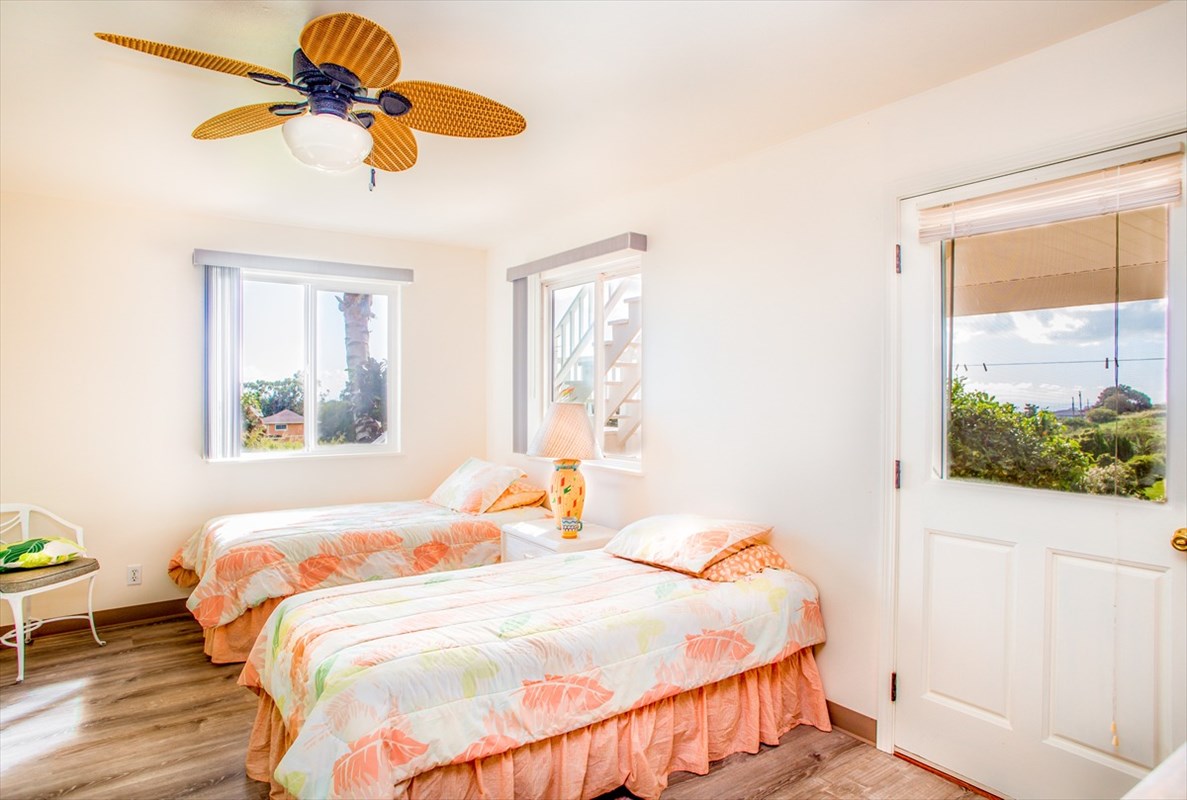 5001 Kikala Road, Unit 1 Kalaheo, HI 96741 - Photo 10 of 14 a bedroom with a bed and a window