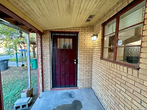 a view of a porch with wooden floor and stairs