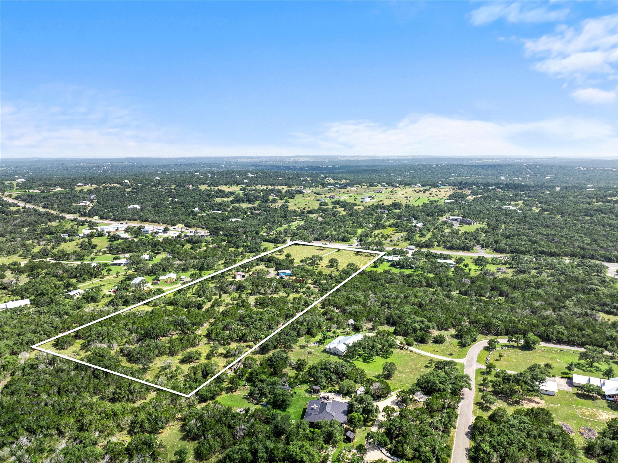 8200 Ranch Road 12 San Marcos, TX 78666 - Photo 34 of 40 Vast green spaces frame this tranquil, generously sized lot, offering privacy and natural beauty.