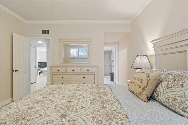 a bedroom with a bed and a mirror