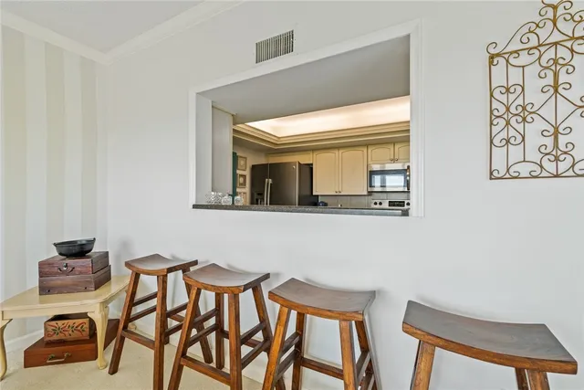 a view of a dining room with furniture and a window