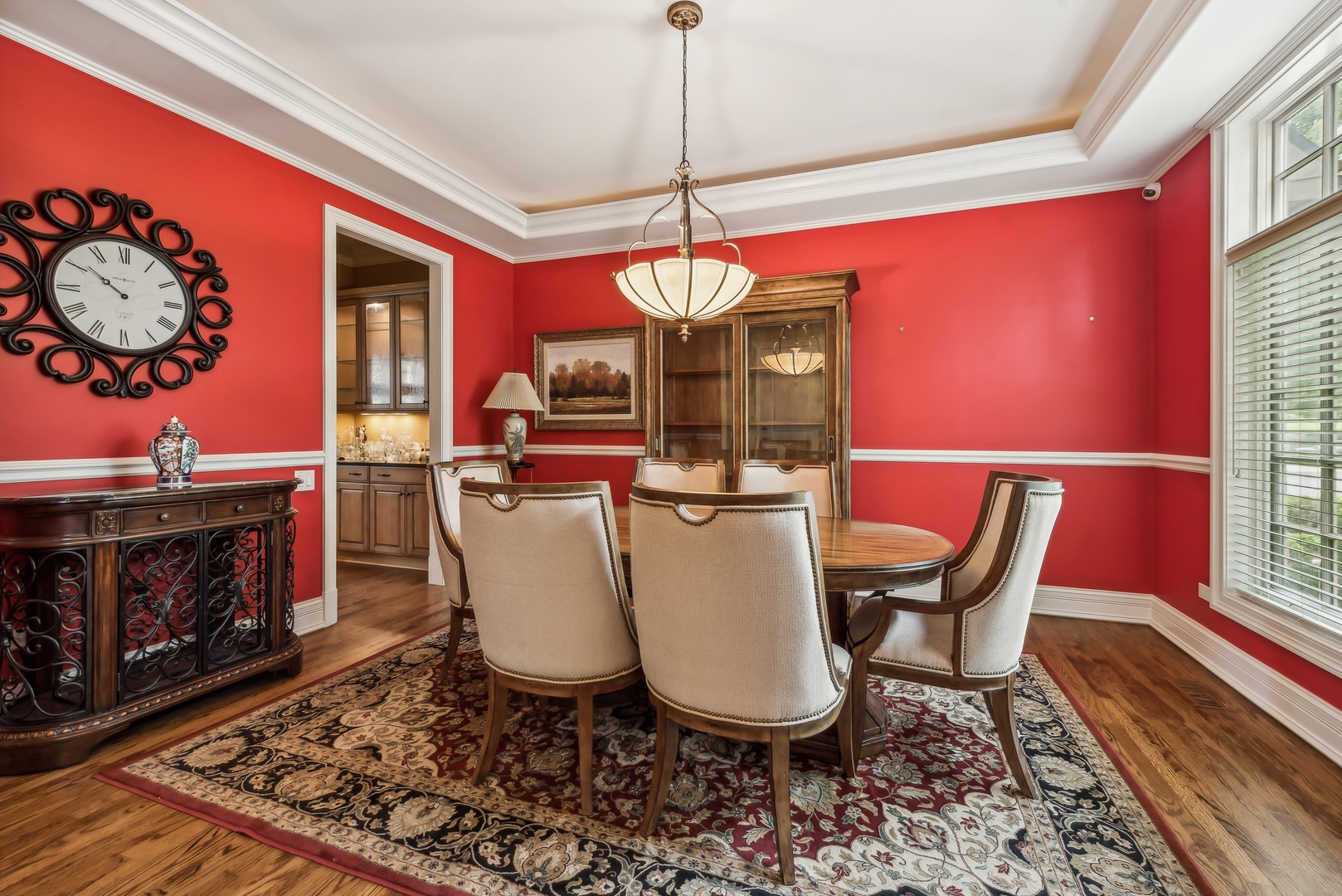 9 Willowcrest Drive, Unit 9 Oak Brook, IL 60523 - Photo 2 of 37 a dining room with furniture a fireplace and wooden floor