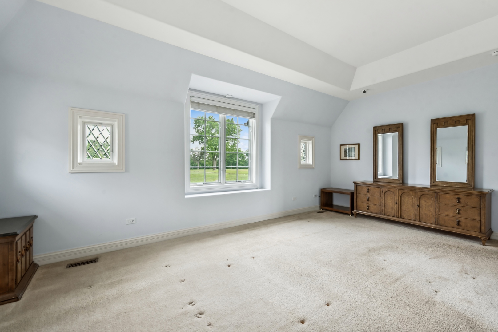 9 Willowcrest Drive, Unit 9 Oak Brook, IL 60523 - Photo 21 of 37 a view of an empty room with a window