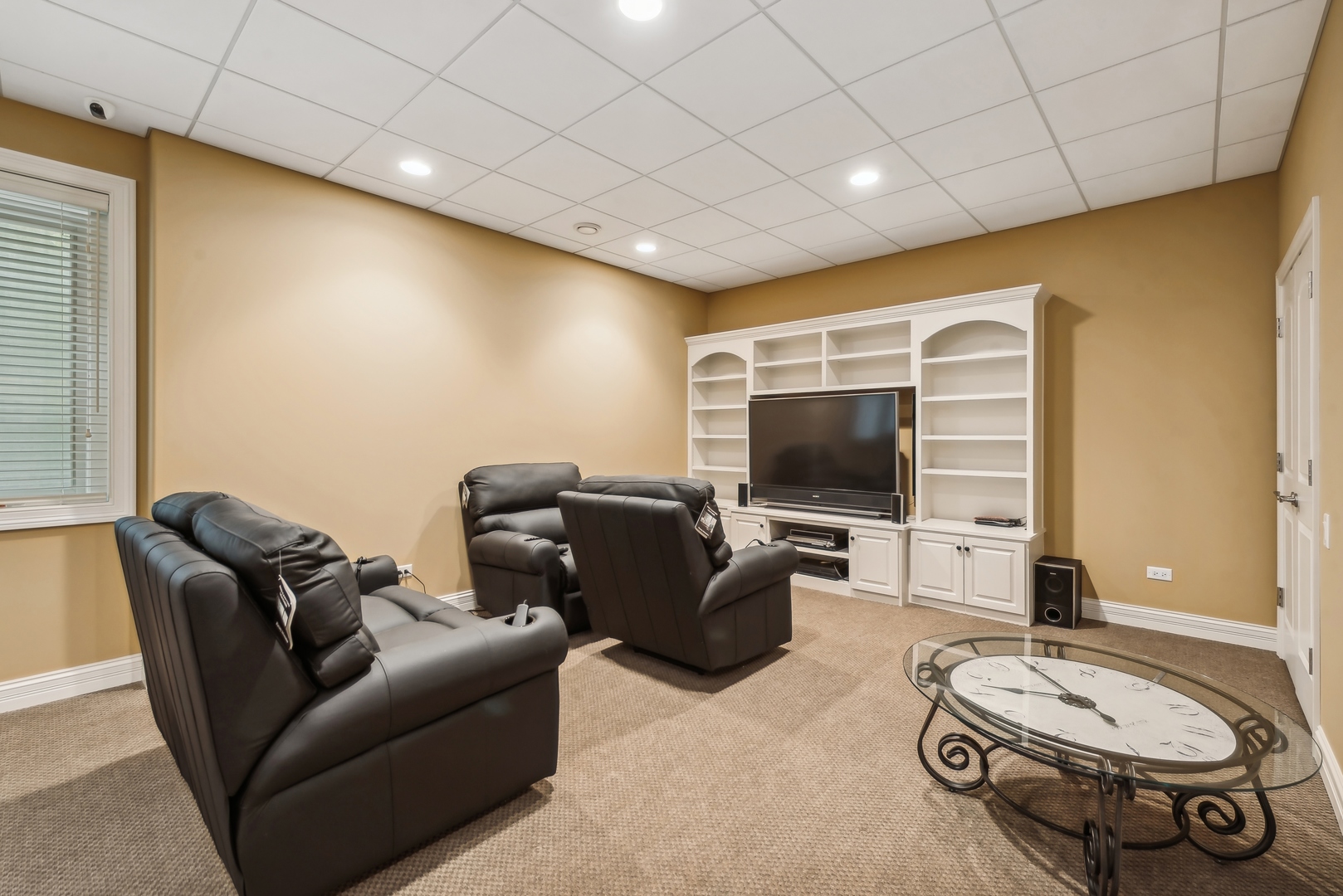 9 Willowcrest Drive, Unit 9 Oak Brook, IL 60523 - Photo 28 of 37 a living room with furniture and a flat screen tv