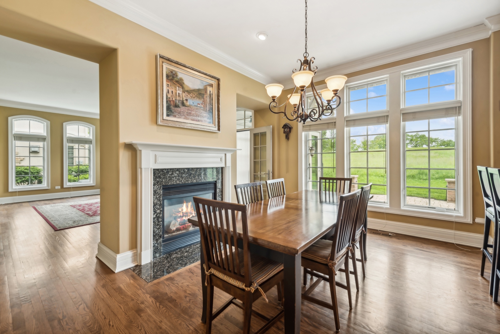 9 Willowcrest Drive, Unit 9 Oak Brook, IL 60523 - Photo 10 of 37 a view of a dining room with furniture wooden floor and chandelier