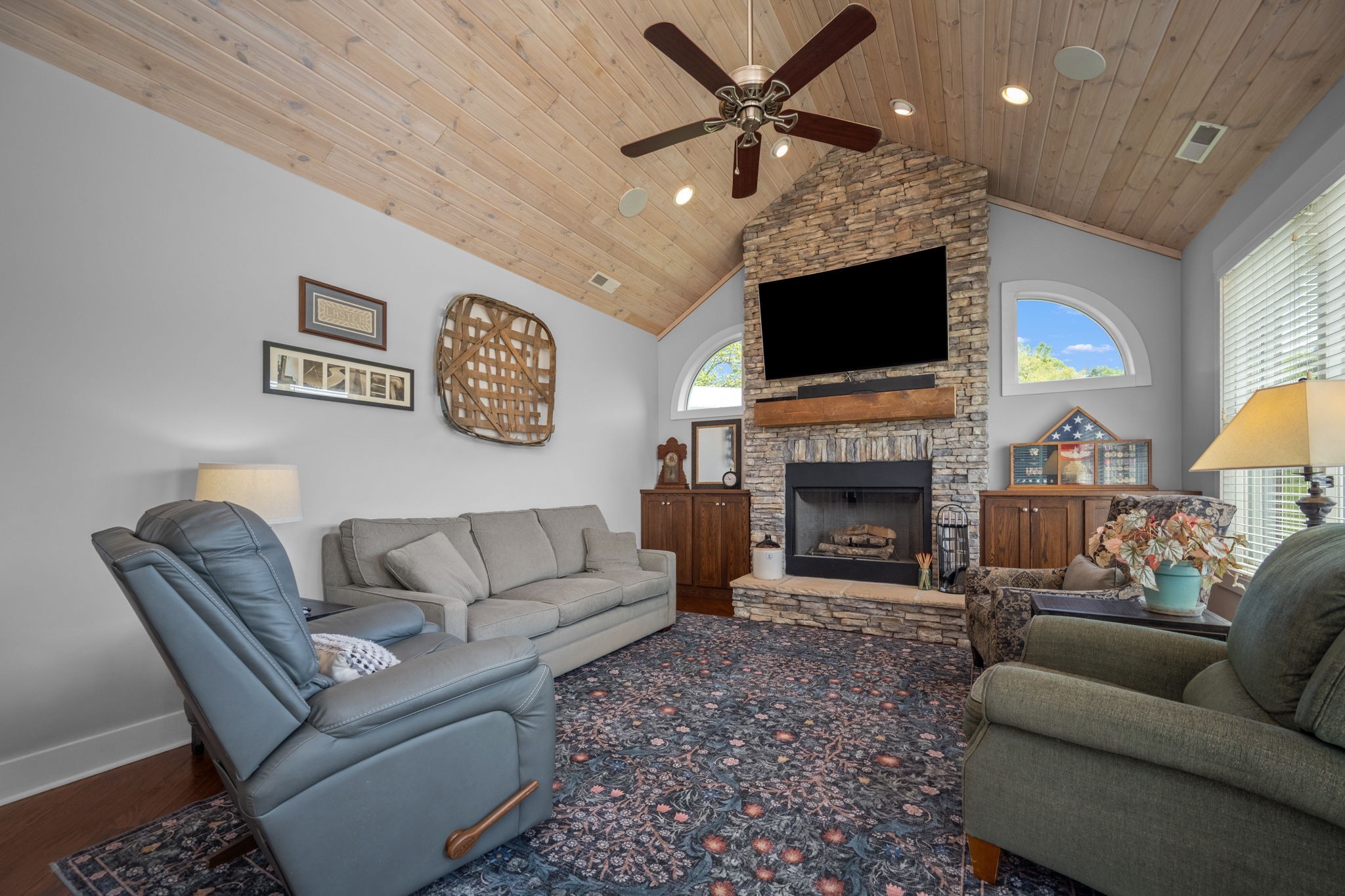 50 Bill Edde Road Belvidere, TN 37306 - Photo 29 of 63 a living room with furniture a flat screen tv and a fireplace