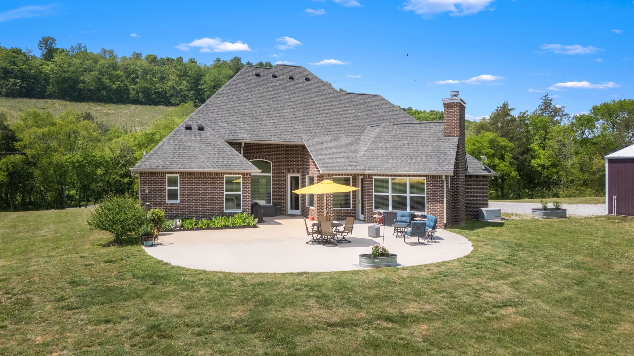 50 Bill Edde Road Belvidere, TN 37306 - Photo 4 of 63 a view of a house with a yard patio and fire pit