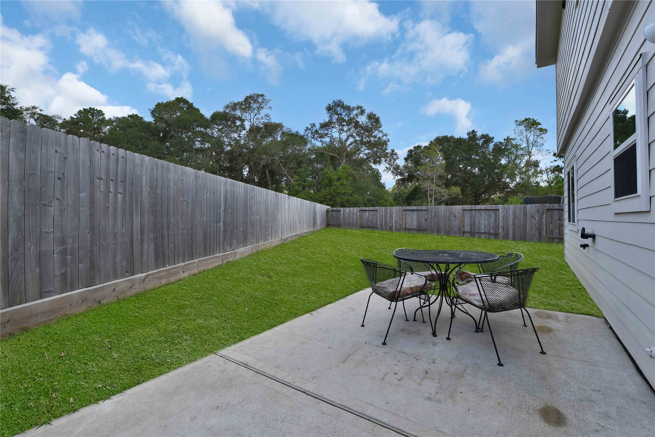 17703 Lion Heart Road Conroe, TX 77306 - Photo 26 of 26 a patio with table and chairs