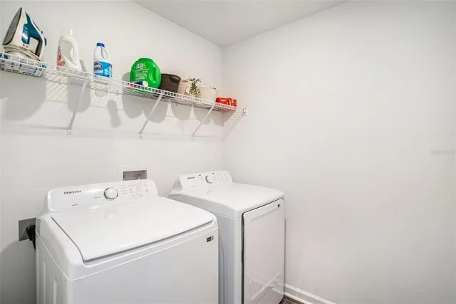 a utility room with dryer and washer