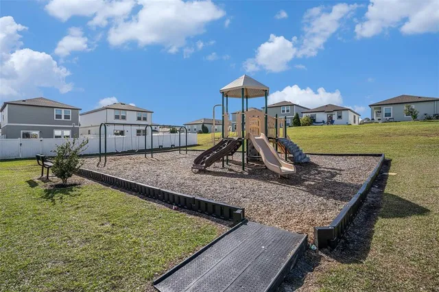 a view of a backyard with a slide