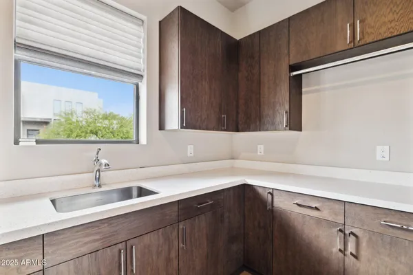 a kitchen with a sink and cabinets