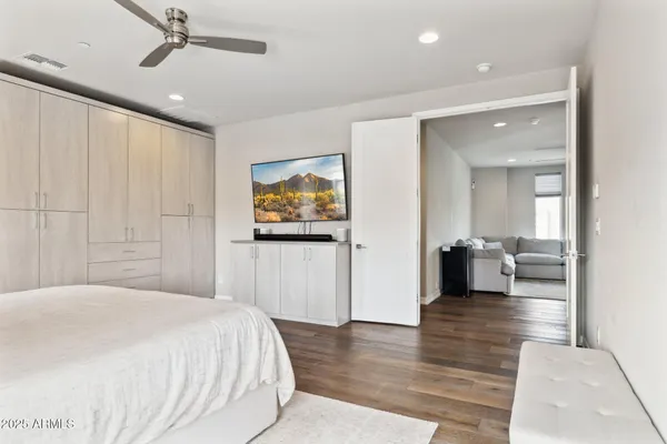 a bedroom with a bed and a view